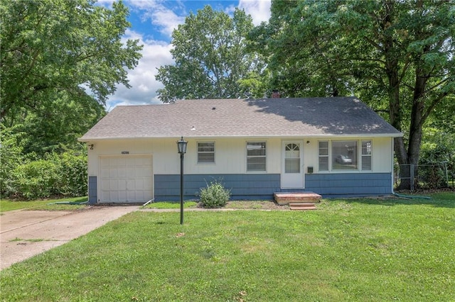 11417 Applewood Dr, Kansas City, MO 64134 - view of front facade with an attached garage, driveway, and roof with shingles