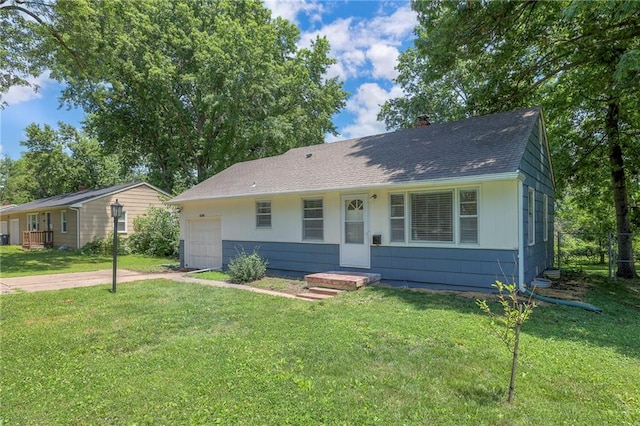 11417 Applewood Dr, Kansas City, MO 64134 - view of front of property featuring a shingled roof, a chimney, a garage, and driveway