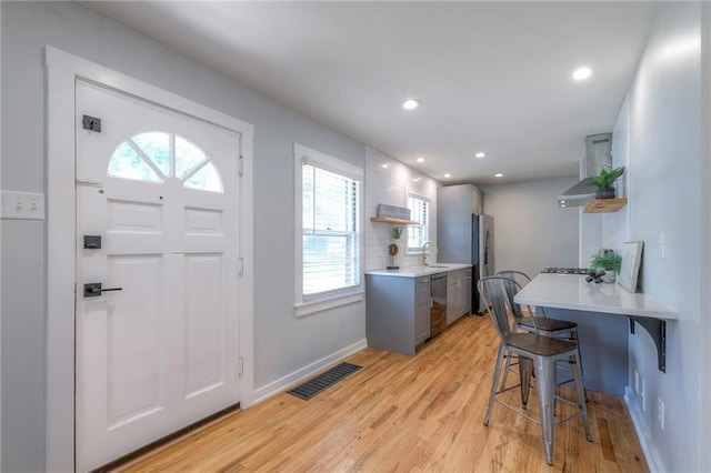 11417 Applewood Dr, Kansas City, MO 64134 - entryway with light wood-style floors and recessed lighting