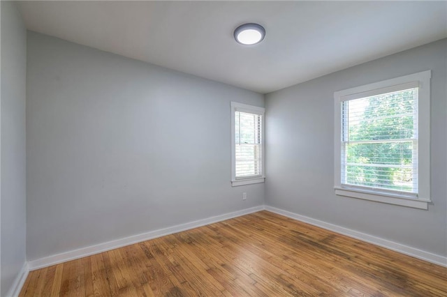 11417 Applewood Dr, Kansas City, MO 64134 - unfurnished room with baseboards and wood finished floors
