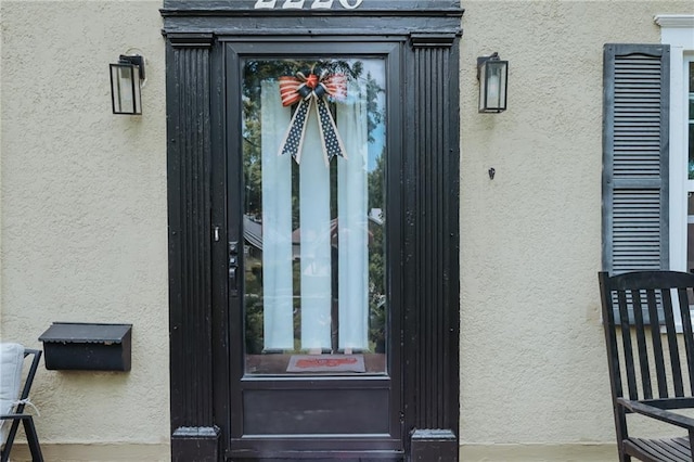 2220 Eugene Field Ave, Saint Joseph, MO 64505 - doorway to property featuring stucco siding
