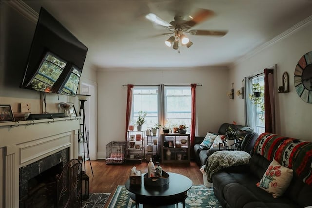 2220 Eugene Field Ave, Saint Joseph, MO 64505 - living area with plenty of natural light, a ceiling fan, ornamental molding, and a premium fireplace