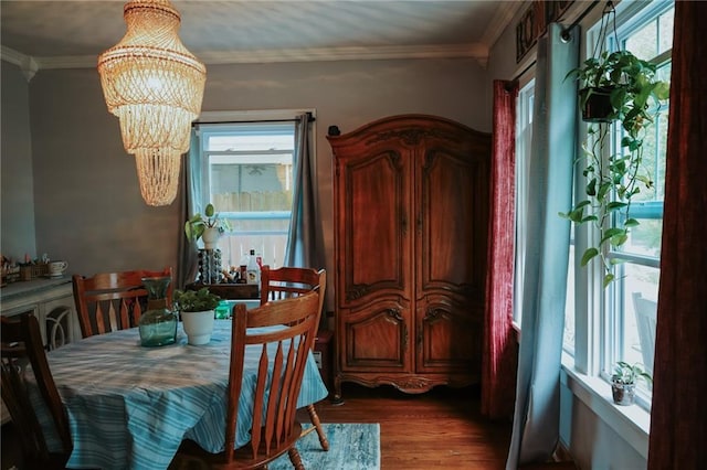 2220 Eugene Field Ave, Saint Joseph, MO 64505 - dining room featuring a chandelier, wood finished floors, and ornamental molding