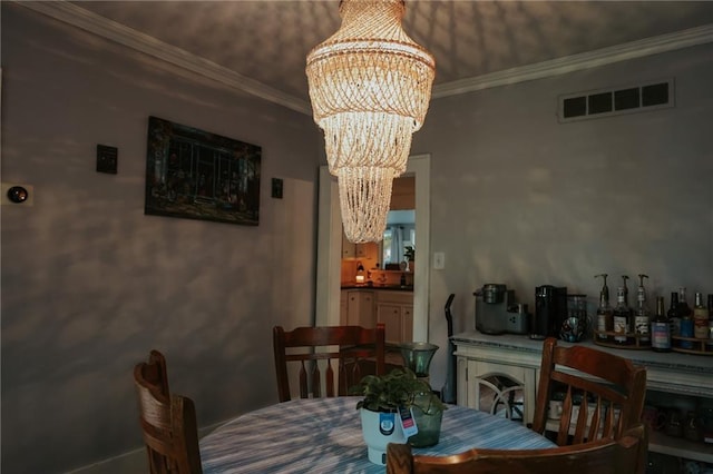 2220 Eugene Field Ave, Saint Joseph, MO 64505 - dining room with a chandelier and ornamental molding