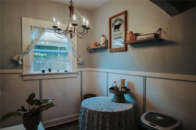 2220 Eugene Field Ave, Saint Joseph, MO 64505 - dining space with a chandelier, wainscoting, and a decorative wall
