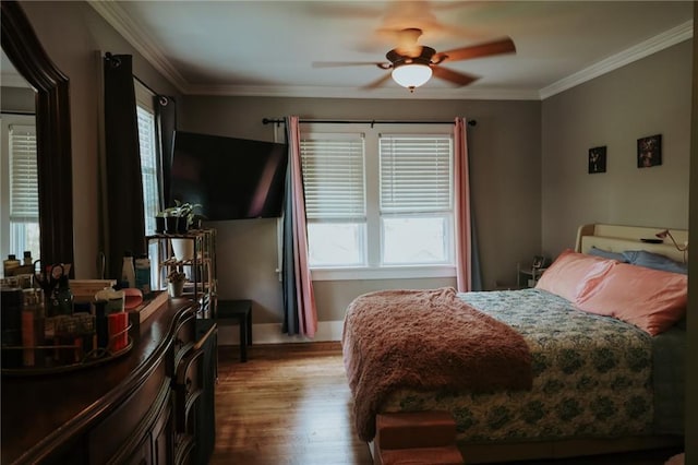 2220 Eugene Field Ave, Saint Joseph, MO 64505 - bedroom with wood finished floors, ornamental molding, and ceiling fan