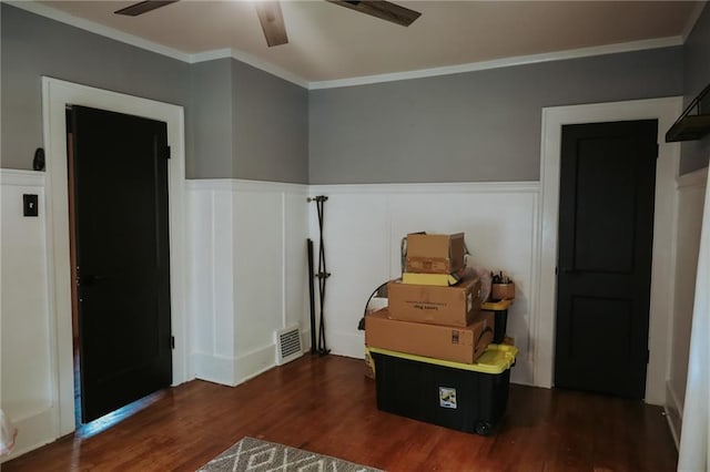 2220 Eugene Field Ave, Saint Joseph, MO 64505 - bedroom with wood finished floors, a wainscoted wall, crown molding, a decorative wall, and ceiling fan
