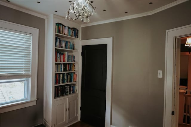 2220 Eugene Field Ave, Saint Joseph, MO 64505 - hall featuring a chandelier, ornamental molding, and built in shelves