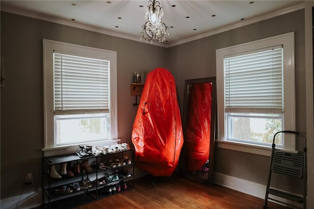2220 Eugene Field Ave, Saint Joseph, MO 64505 - misc room featuring wood finished floors, a chandelier, and crown molding