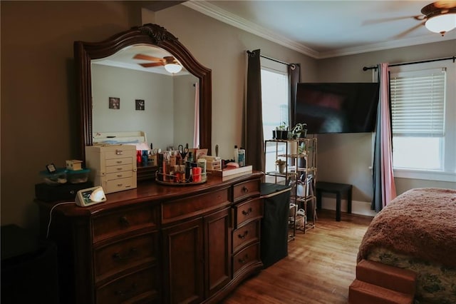 2220 Eugene Field Ave, Saint Joseph, MO 64505 - bedroom featuring multiple windows, wood finished floors, ornamental molding, and ceiling fan