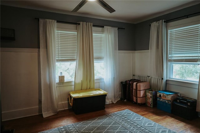 2220 Eugene Field Ave, Saint Joseph, MO 64505 - bedroom featuring wood finished floors, wainscoting, a ceiling fan, and ornamental molding