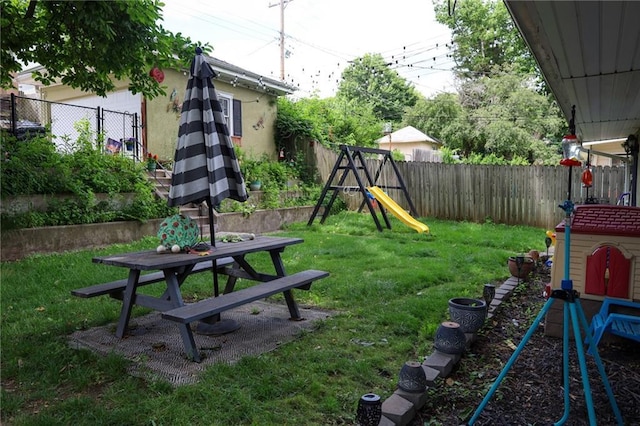 2220 Eugene Field Ave, Saint Joseph, MO 64505 - fenced backyard featuring a playground