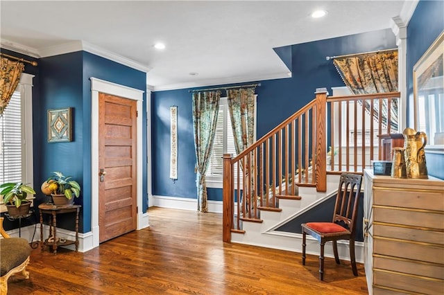 3215 Windsor Ave, Kansas City, MO 64123 - foyer entrance featuring wood finished floors, ornamental molding, stairs, and recessed lighting