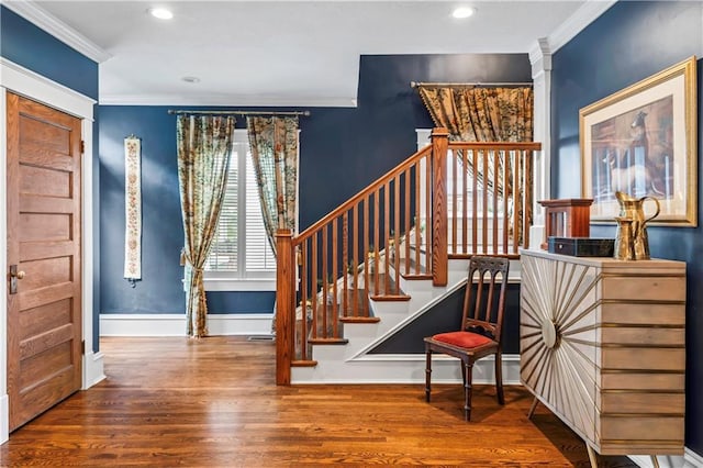 3215 Windsor Ave, Kansas City, MO 64123 - entryway with wood finished floors, stairs, crown molding, and recessed lighting