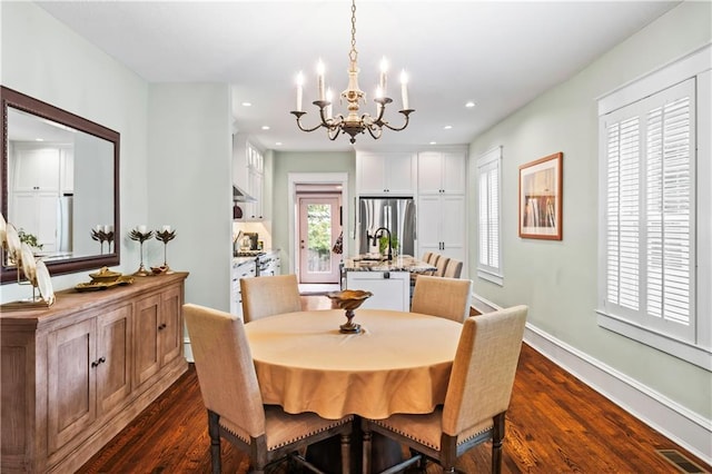 3215 Windsor Ave, Kansas City, MO 64123 - dining area featuring a chandelier, dark wood-type flooring, and recessed lighting