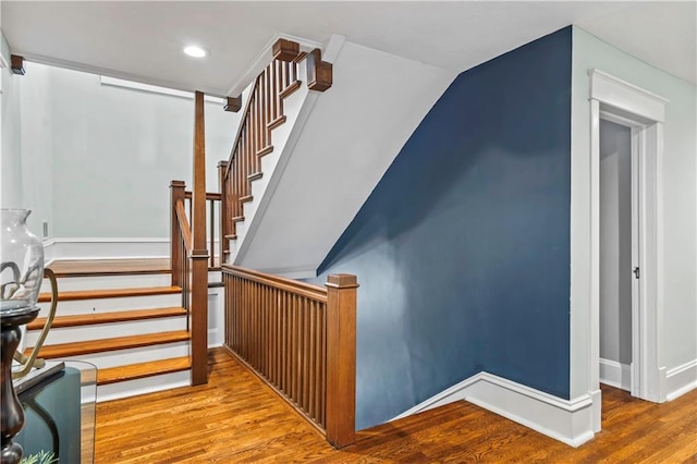 3215 Windsor Ave, Kansas City, MO 64123 - staircase featuring wood finished floors and recessed lighting