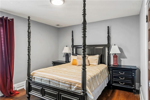 3215 Windsor Ave, Kansas City, MO 64123 - bedroom with dark wood-style floors and baseboards
