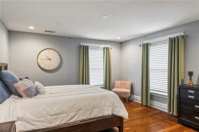 3215 Windsor Ave, Kansas City, MO 64123 - bedroom with dark wood-style flooring and recessed lighting