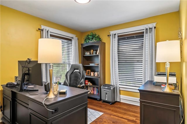 3215 Windsor Ave, Kansas City, MO 64123 - office space featuring dark wood finished floors and baseboards