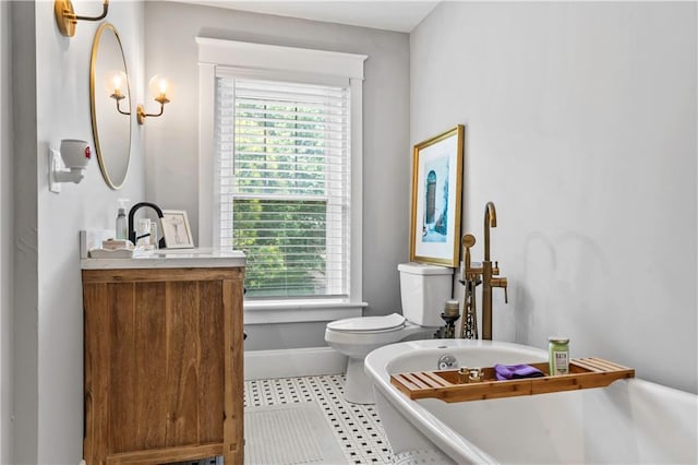 3215 Windsor Ave, Kansas City, MO 64123 - bathroom featuring a freestanding tub and vanity