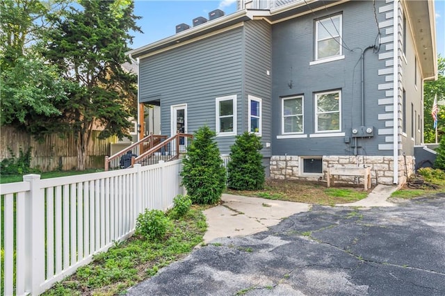 3215 Windsor Ave, Kansas City, MO 64123 - view of side of home featuring a patio area