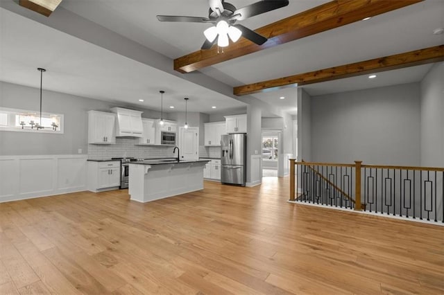 19709 W 198th Ct, Spring Hill, KS 66083 - kitchen featuring stainless steel appliances, dark countertops, custom exhaust hood, light wood-style floors, and recessed lighting
