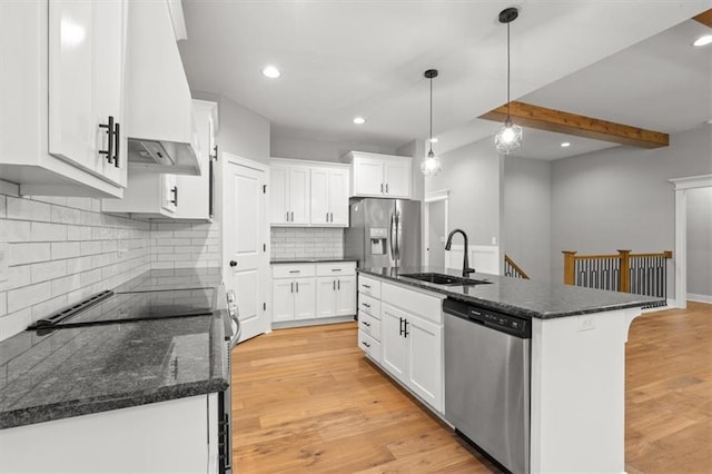 19709 W 198th Ct, Spring Hill, KS 66083 - kitchen featuring stainless steel appliances, premium range hood, white cabinets, decorative backsplash, and light wood-style flooring