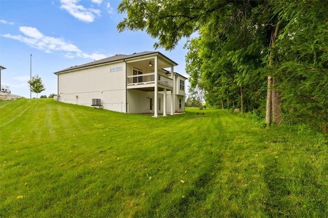 19709 W 198th Ct, Spring Hill, KS 66083 - back of house with a ceiling fan, a yard, and a balcony