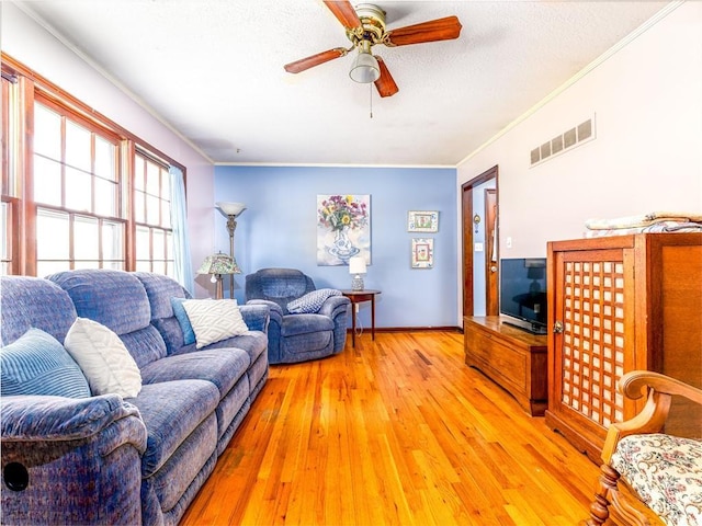607 Green St, Lees Summit, MO 64063 - living room with crown molding, light wood-type flooring, and a ceiling fan