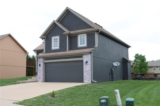1725 N 57th Ter, Kansas City, KS 66102 - view of front of house featuring driveway, a front lawn, and an attached garage
