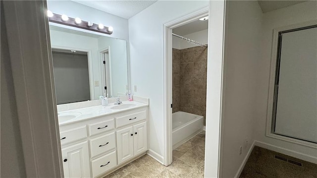 1725 N 57th Ter, Kansas City, KS 66102 - bathroom with double vanity,  shower combination, and tile patterned floors