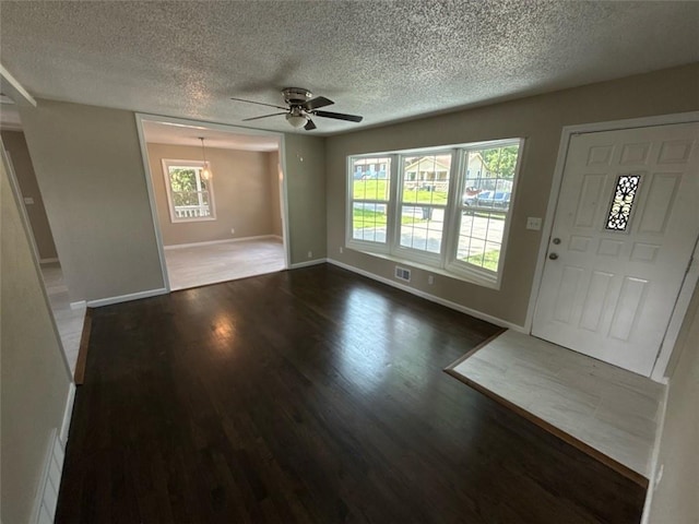 2017 E 83rd Ter, Kansas City, MO 64132 - entrance foyer featuring wood finished floors, a textured ceiling, and ceiling fan