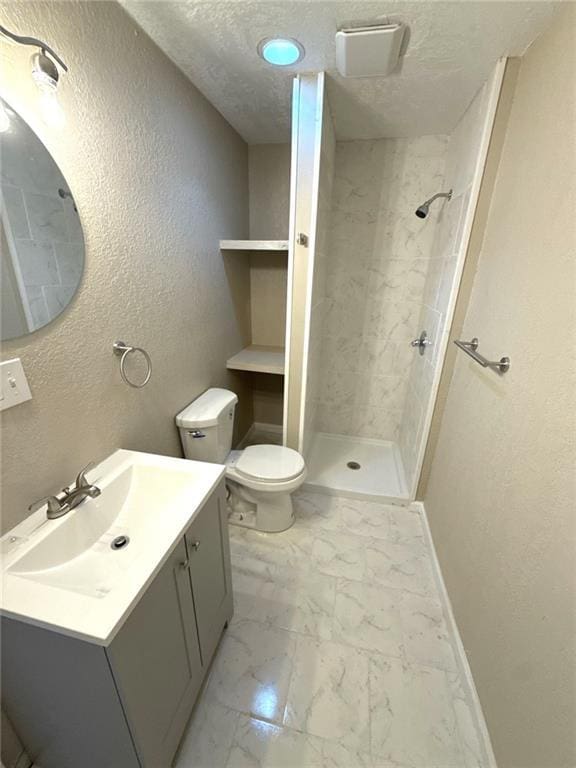 2017 E 83rd Ter, Kansas City, MO 64132 - full bathroom with marble look tiles, vanity, tiled shower, a textured wall, and a textured ceiling
