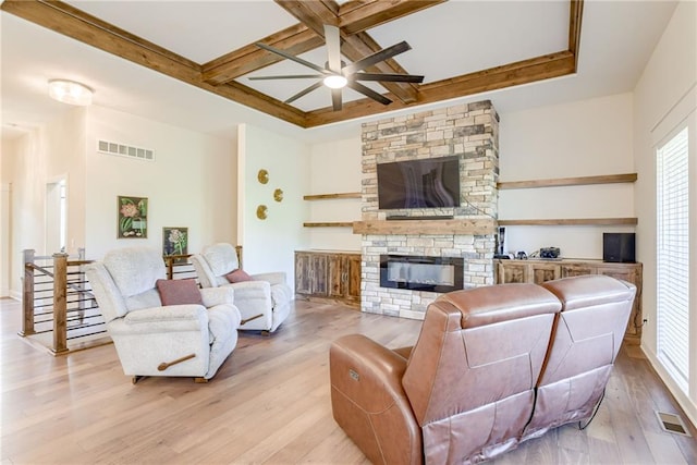 12750 Larkspur Ln, Platte City, MO 64079 - living area with a stone fireplace, light wood-style floors, coffered ceiling, beamed ceiling, and ceiling fan