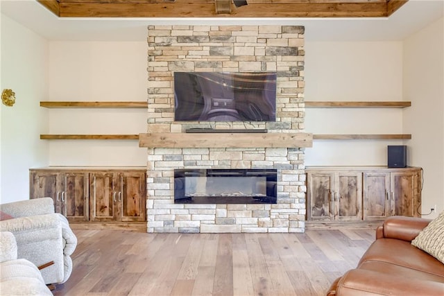 12750 Larkspur Ln, Platte City, MO 64079 - living room with a stone fireplace and hardwood / wood-style floors