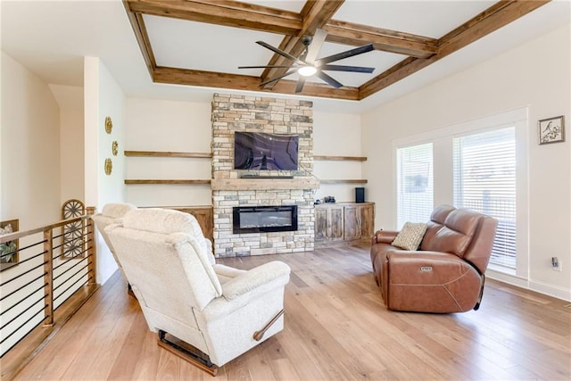 12750 Larkspur Ln, Platte City, MO 64079 - living room featuring a ceiling fan, coffered ceiling, a stone fireplace, light wood finished floors, and beamed ceiling