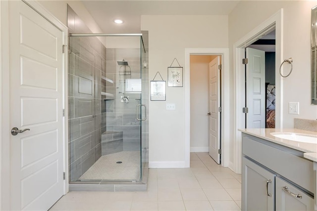 12750 Larkspur Ln, Platte City, MO 64079 - bathroom featuring vanity, a stall shower, tile patterned floors, and recessed lighting