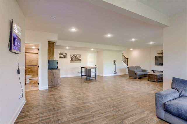 12750 Larkspur Ln, Platte City, MO 64079 - living area featuring wood finished floors, stairway, and recessed lighting