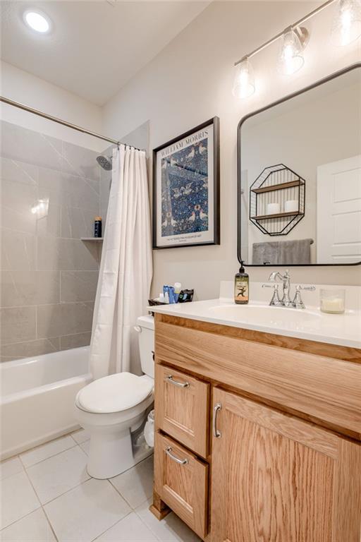 12750 Larkspur Ln, Platte City, MO 64079 - bathroom with tile patterned flooring, vanity, and shower / tub combo