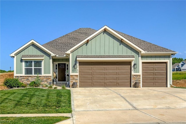 12750 Larkspur Ln, Platte City, MO 64079 - craftsman inspired home with an attached garage, roof with shingles, concrete driveway, board and batten siding, and a front lawn
