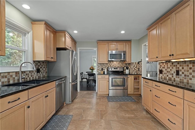 13924 S Summertree Ln, Olathe, KS 66062 - kitchen featuring stainless steel appliances, light brown cabinetry, backsplash, recessed lighting, and dark stone countertops