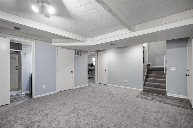 13924 S Summertree Ln, Olathe, KS 66062 - finished below grade area with a textured ceiling, carpet floors, and stairs