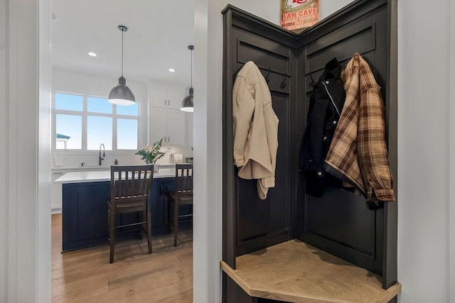 13404 W 177th St, Overland Park, KS 66013 - mudroom with light wood finished floors and recessed lighting