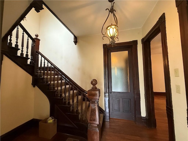 624 S St, Atchison, KS 66002 - entrance foyer with wood finished floors and stairs