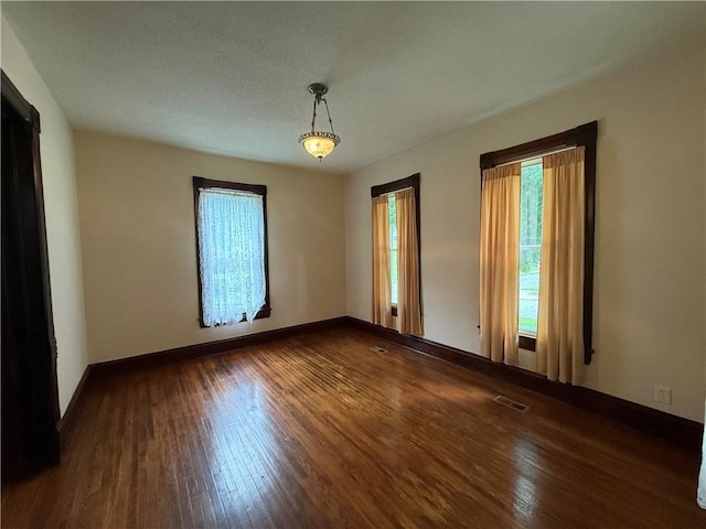 624 S St, Atchison, KS 66002 - unfurnished room featuring hardwood / wood-style floors