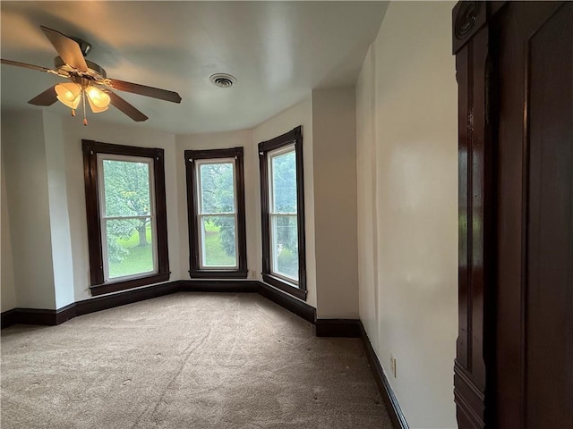 624 S St, Atchison, KS 66002 - carpeted empty room featuring baseboards and ceiling fan