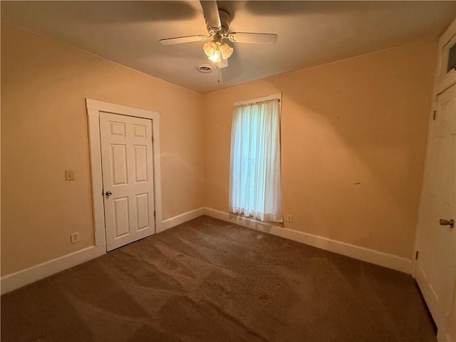 624 S St, Atchison, KS 66002 - empty room featuring ceiling fan and dark colored carpet