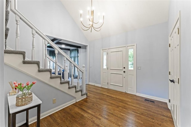 2405 W 124th St, Leawood, KS 66209 - entrance foyer with a chandelier, stairway, wood finished floors, and high vaulted ceiling