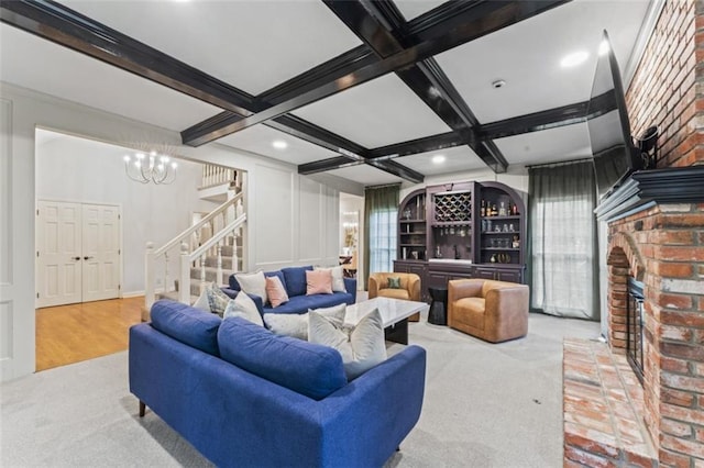 2405 W 124th St, Leawood, KS 66209 - living area featuring stairs, beam ceiling, carpet floors, coffered ceiling, and a chandelier