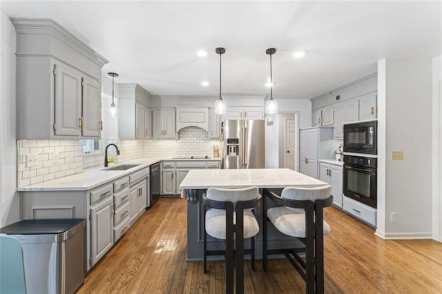 2405 W 124th St, Leawood, KS 66209 - kitchen featuring black appliances, gray cabinetry, decorative backsplash, recessed lighting, and light wood-style floors